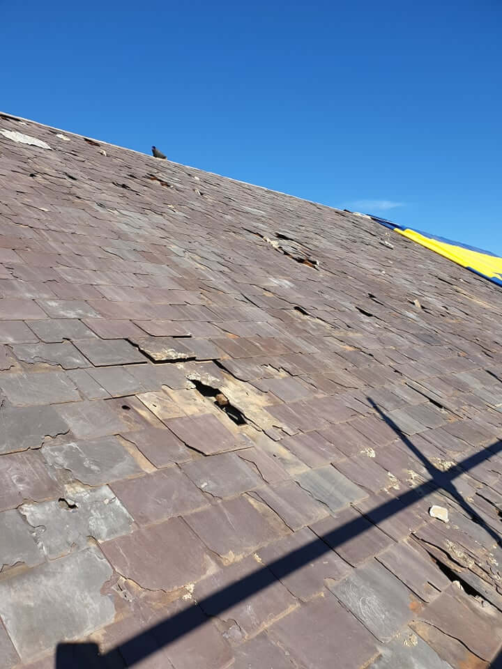 old damaged slate roof